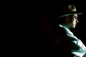 Profile of man wearing hat and glasses