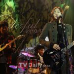 Rock trio performing live on stage