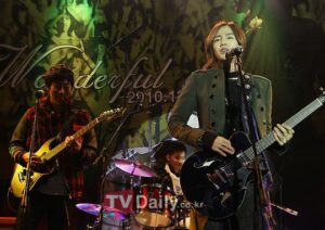Rock trio performing live on stage