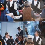 Woman in period costume photographing communal meal