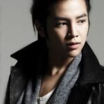 Young man in leather jacket and scarf