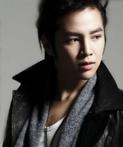 Young man in leather jacket and scarf