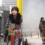 Young couple holding hands in patterned coats