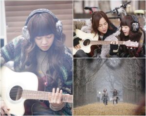 Friends playing guitar and biking in winter
