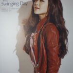 Woman in brown leather jacket, long hair