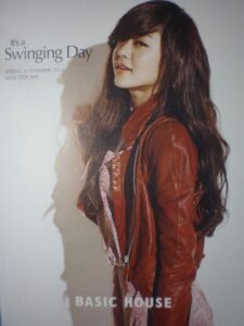 Woman in brown leather jacket, long hair