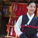 Smiling woman wearing traditional Korean hanbok