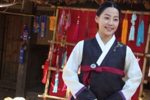 Smiling woman wearing traditional Korean hanbok
