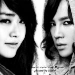 Black-and-white close-up portrait of two people