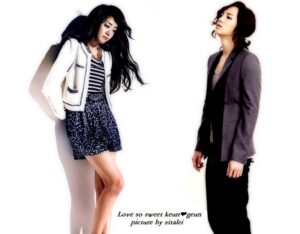Two stylish women in jackets on white background