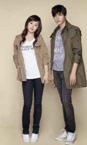 Two young adults wearing casual jackets and sneakers