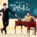 Man in suit tugging woman at ornate desk
