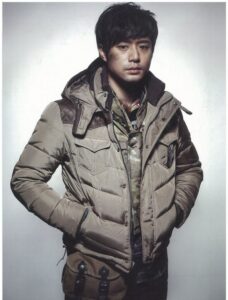 Man in tan puffer jacket with satchel