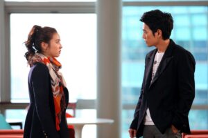 Two people facing each other in office