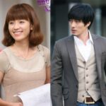 Smiling woman and suited man side-by-side