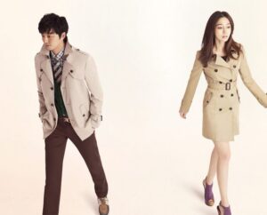 Man and woman wearing beige trench coats