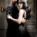 Couple embracing in elegant black formal attire