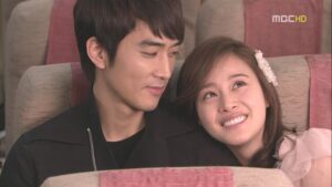 Young couple smiling while seated together