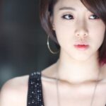 Close-up of young woman with hoop earring