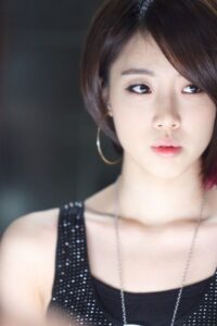 Close-up of young woman with hoop earring
