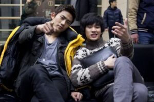 Two friends posing and gesturing on couch