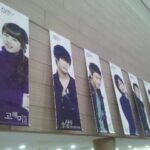 Row of vertical portrait banners in hallway