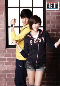 Two young people posing in sporty casual clothes