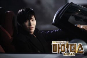 Person sitting in convertible with MIDAS logo