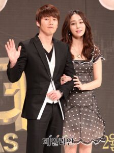 Man and woman posing at awards event