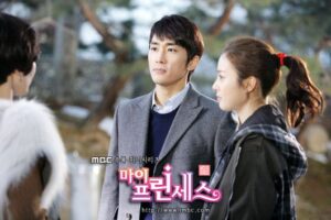 Two people conversing outdoors in TV drama
