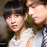 Young woman looking at man in formal attire