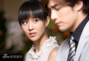 Young woman looking at man in formal attire