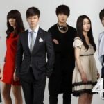 Group of six stylishly dressed young adults