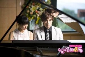 Young man and woman at grand piano