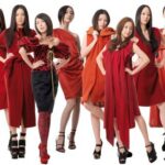 Group of models in red dresses