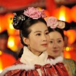 Women in traditional Chinese dress with lanterns