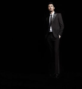 Man in black tuxedo, hands in pockets