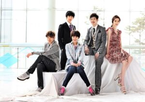 Five young adults posing in stylish outfits