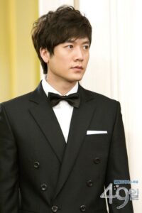 Man in black tuxedo with bow tie