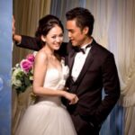 Bride and groom smiling in wedding portrait