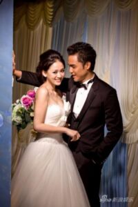 Bride and groom smiling in wedding portrait