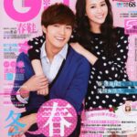 Smiling young man and woman on pink magazine