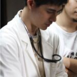 Doctor wearing white coat with stethoscope