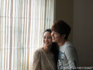 Smiling couple by window