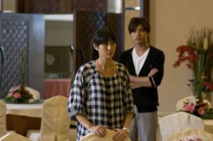 Woman and man standing in banquet hall