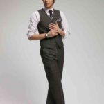 Man in gray vest and tie