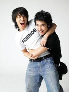 Two young friends hugging and laughing