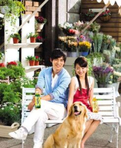 Couple with golden retriever at flower shop