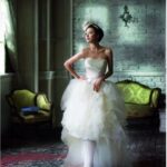 Bride in layered tulle gown in vintage room
