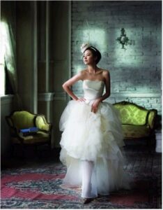 Bride in layered tulle gown in vintage room